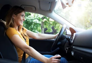 Woman driving automobile.