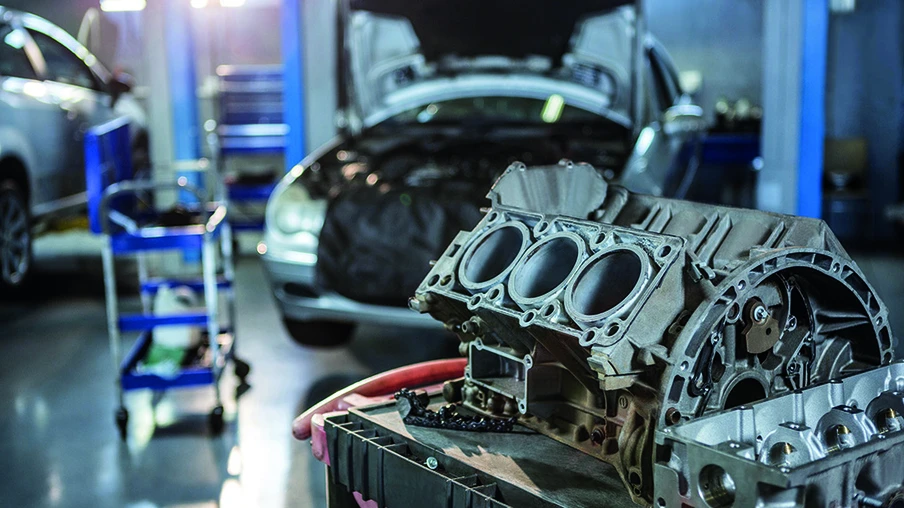 Close-up of car parts in repair garage